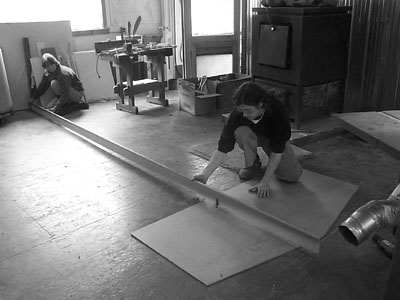 Todd and his beautiful assistant (and wife), Kathy, laying out the radii of the desk using a 15 foot (approximately) beam compass.